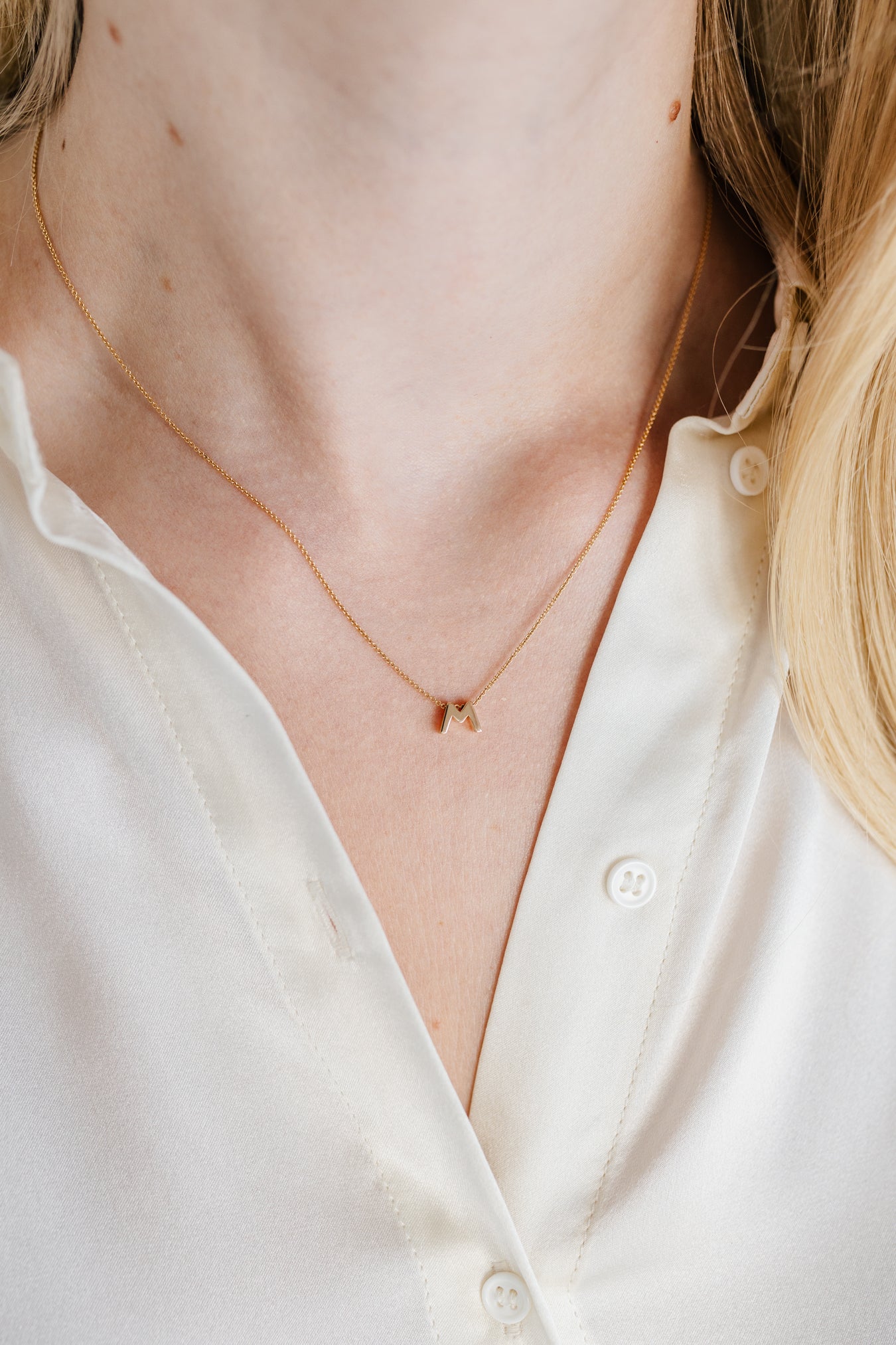 18-karat gold letter necklace with three letters