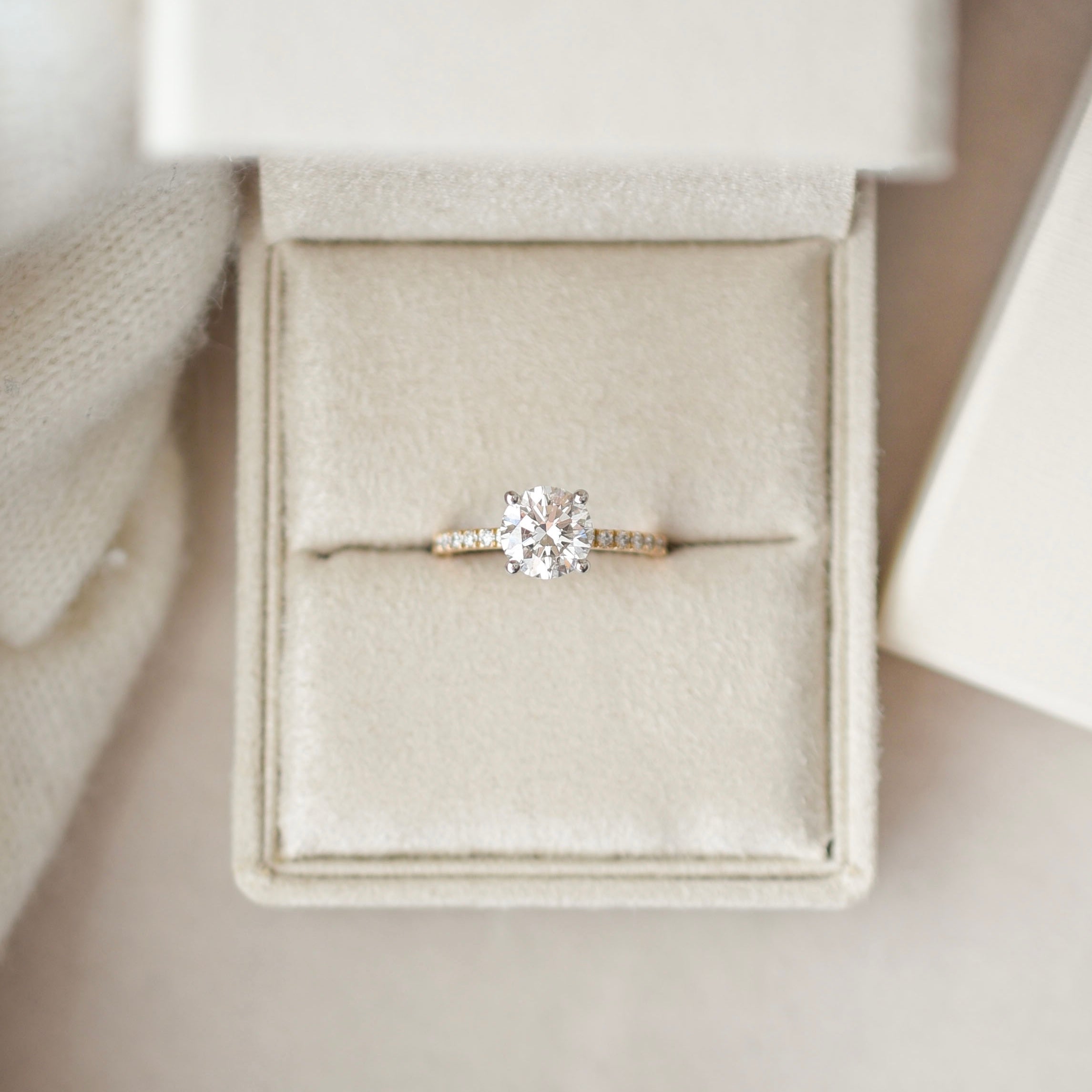 Round solitaire engagement ring with pave band - 18-karat gold with platinum prongs