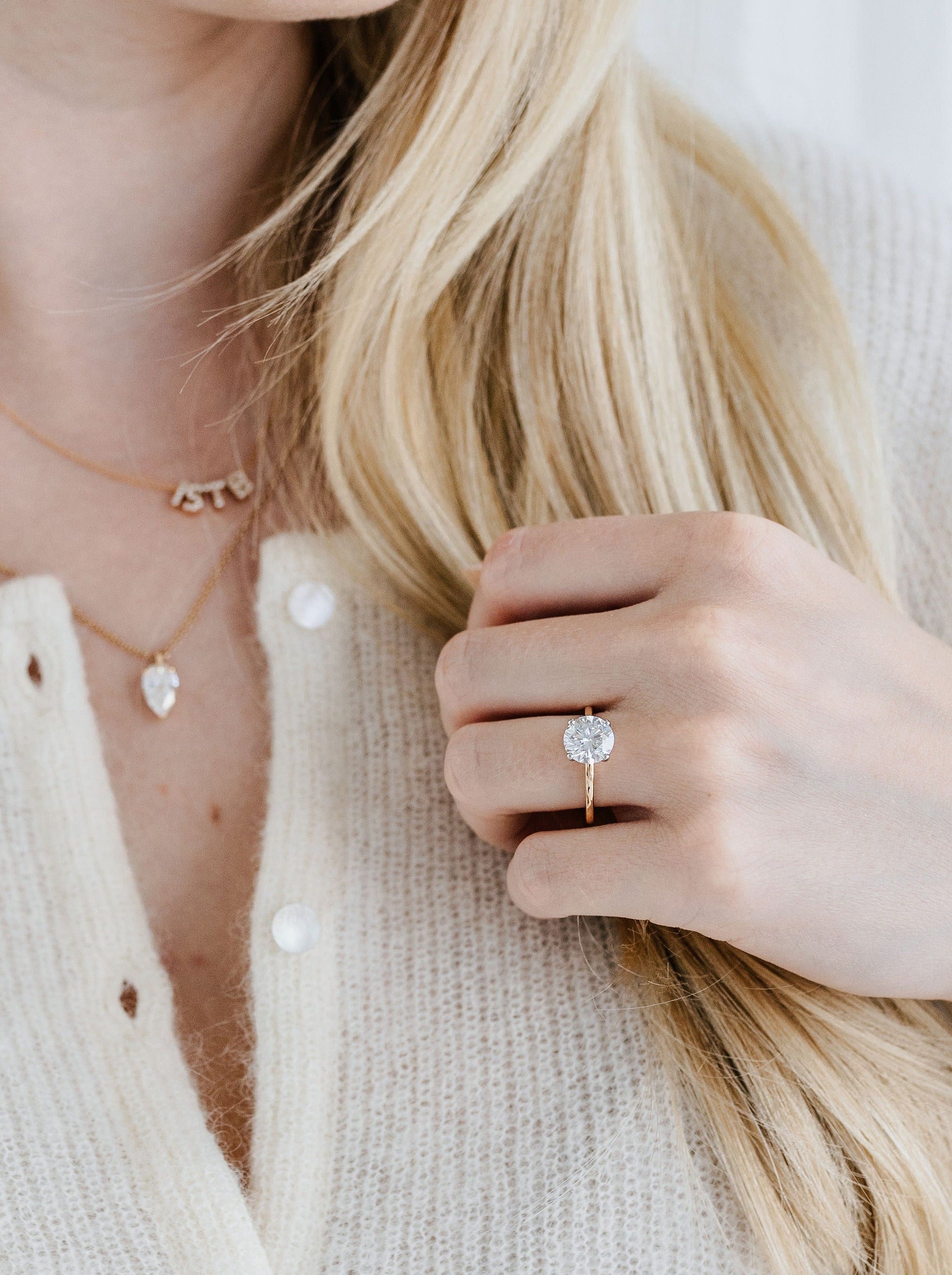 Round solitaire engagement ring - 18-karat yellow gold with platinum prongs