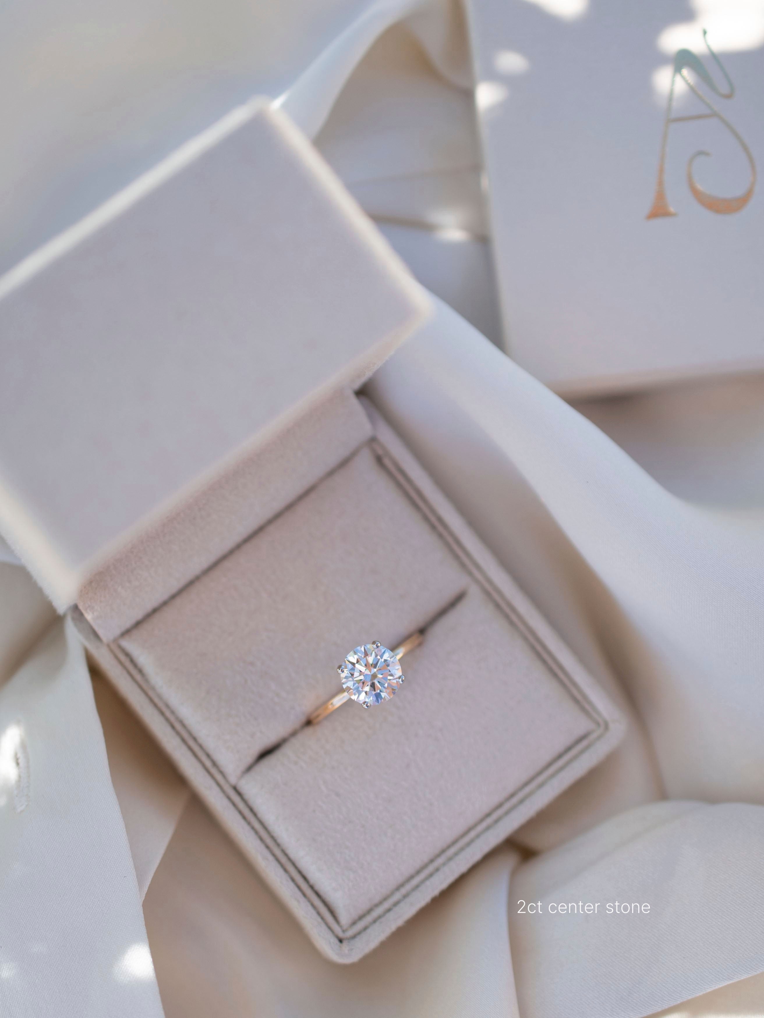 Round solitaire engagement ring - 18-karat yellow gold with platinum prongs