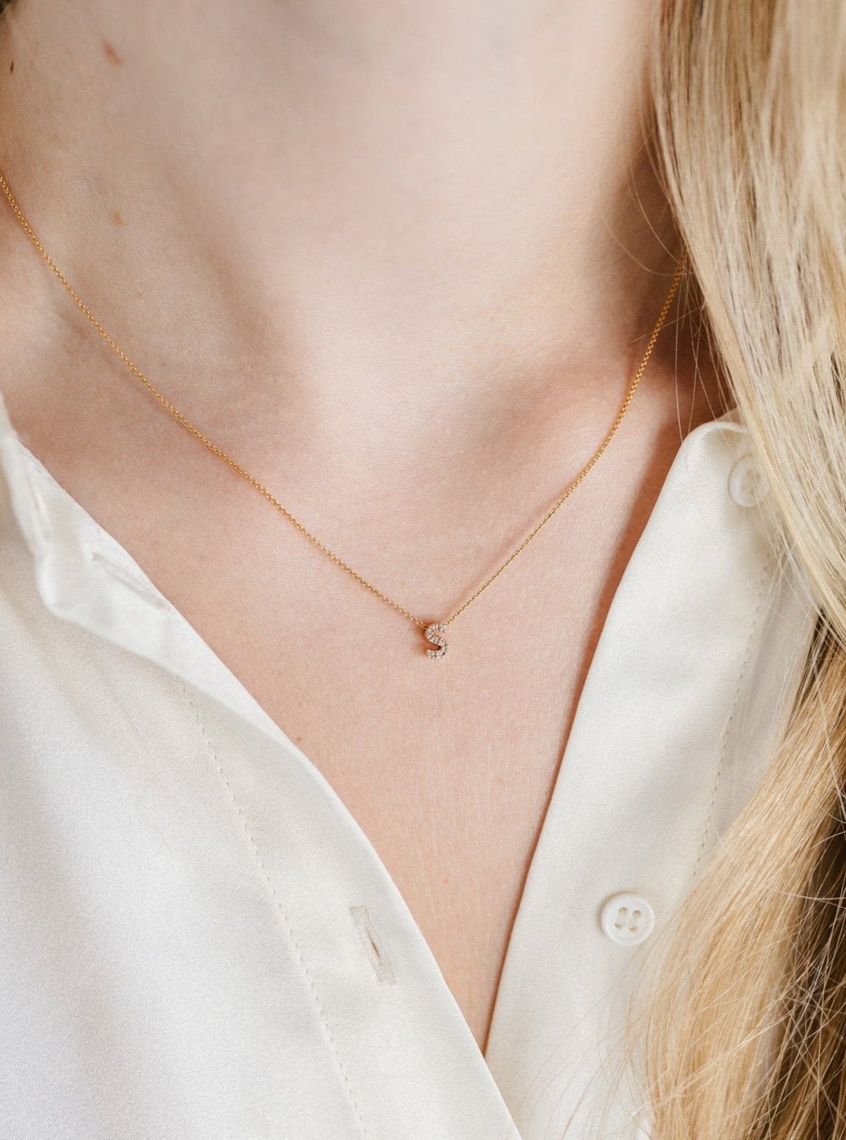 18-karat gold letter necklace with one diamond letter