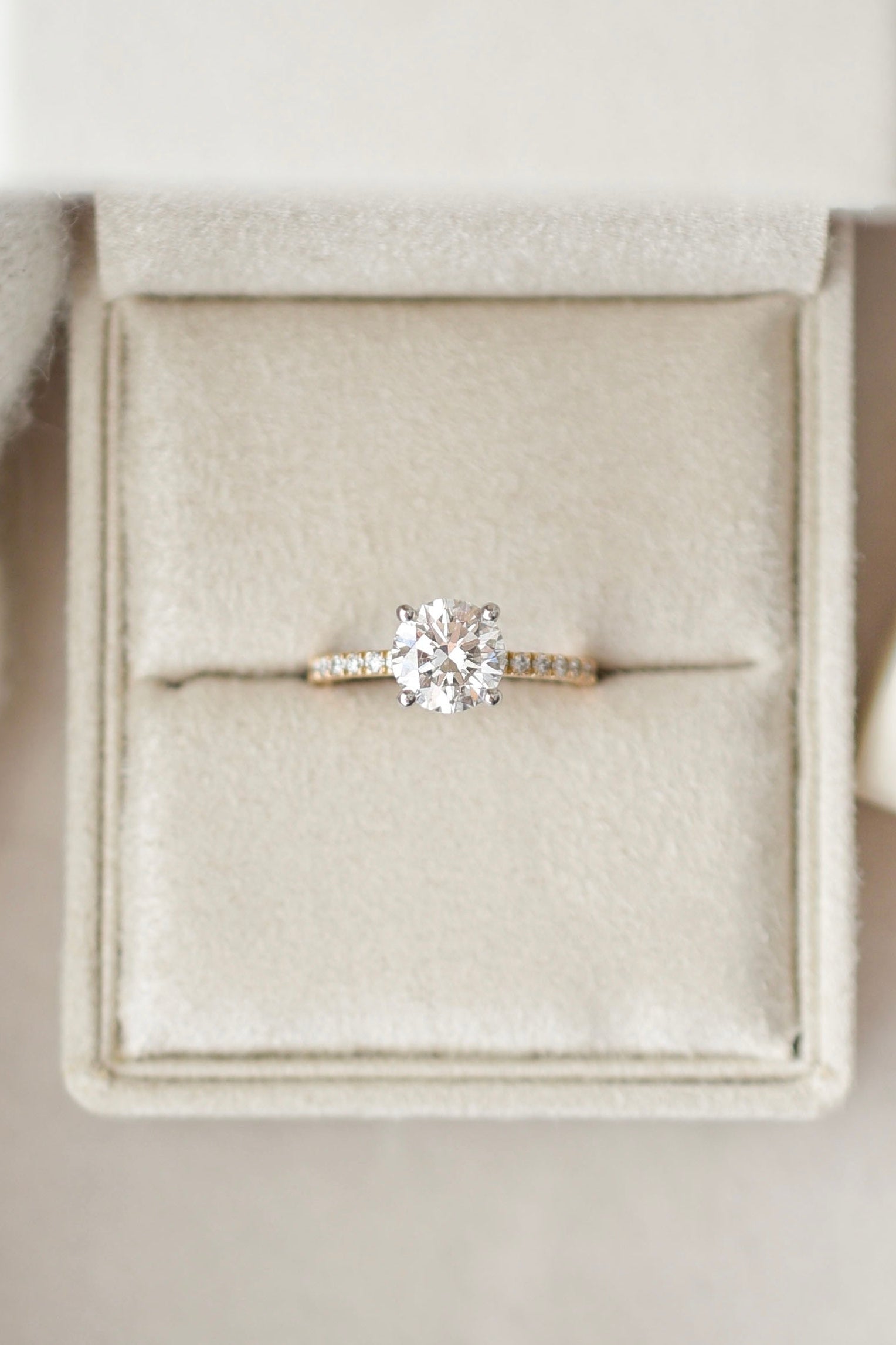 Round solitaire engagement ring with pave band - 18-karat gold with platinum prongs