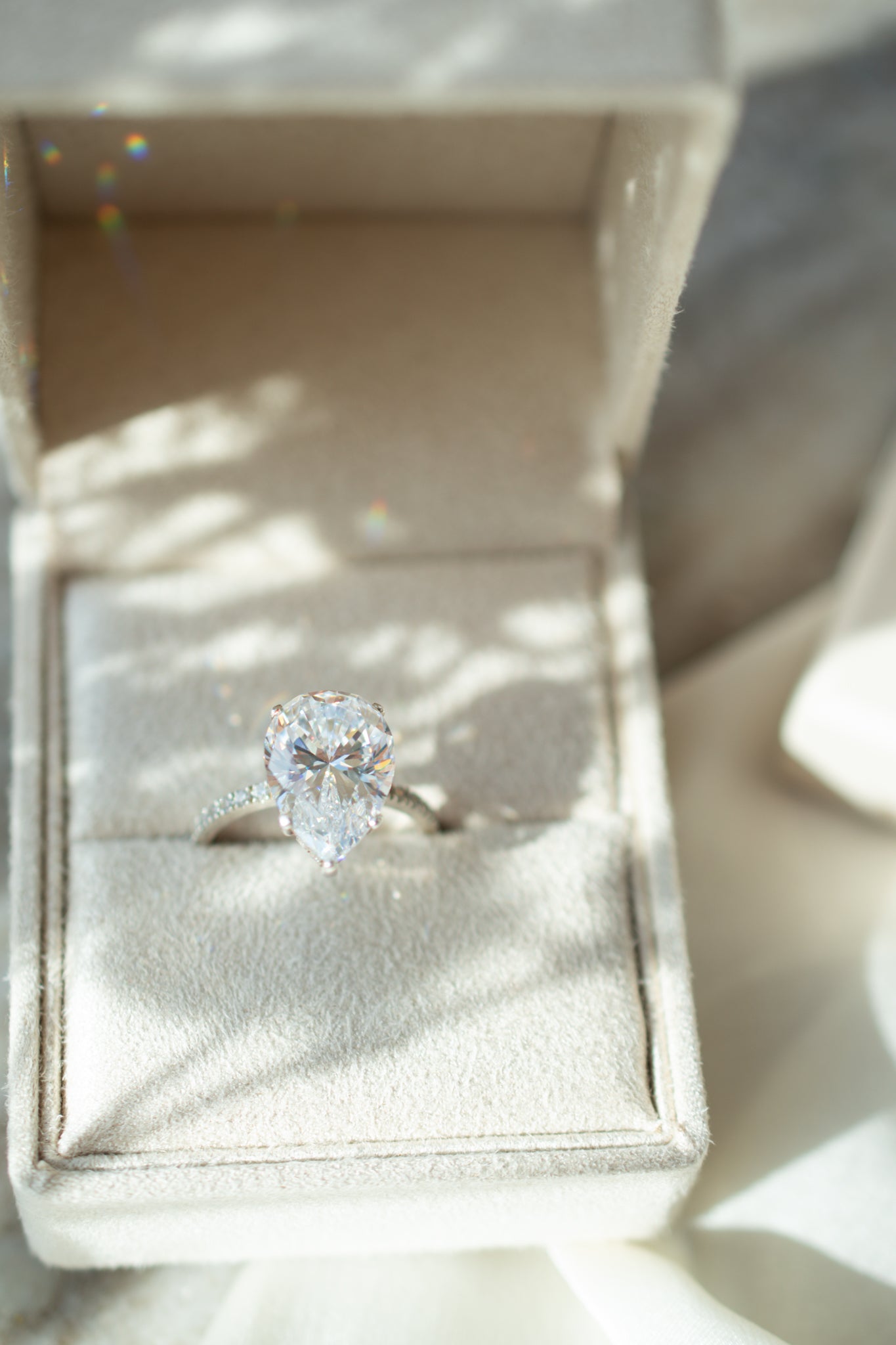 Pear solitaire engagament ring with pave band - platinum
