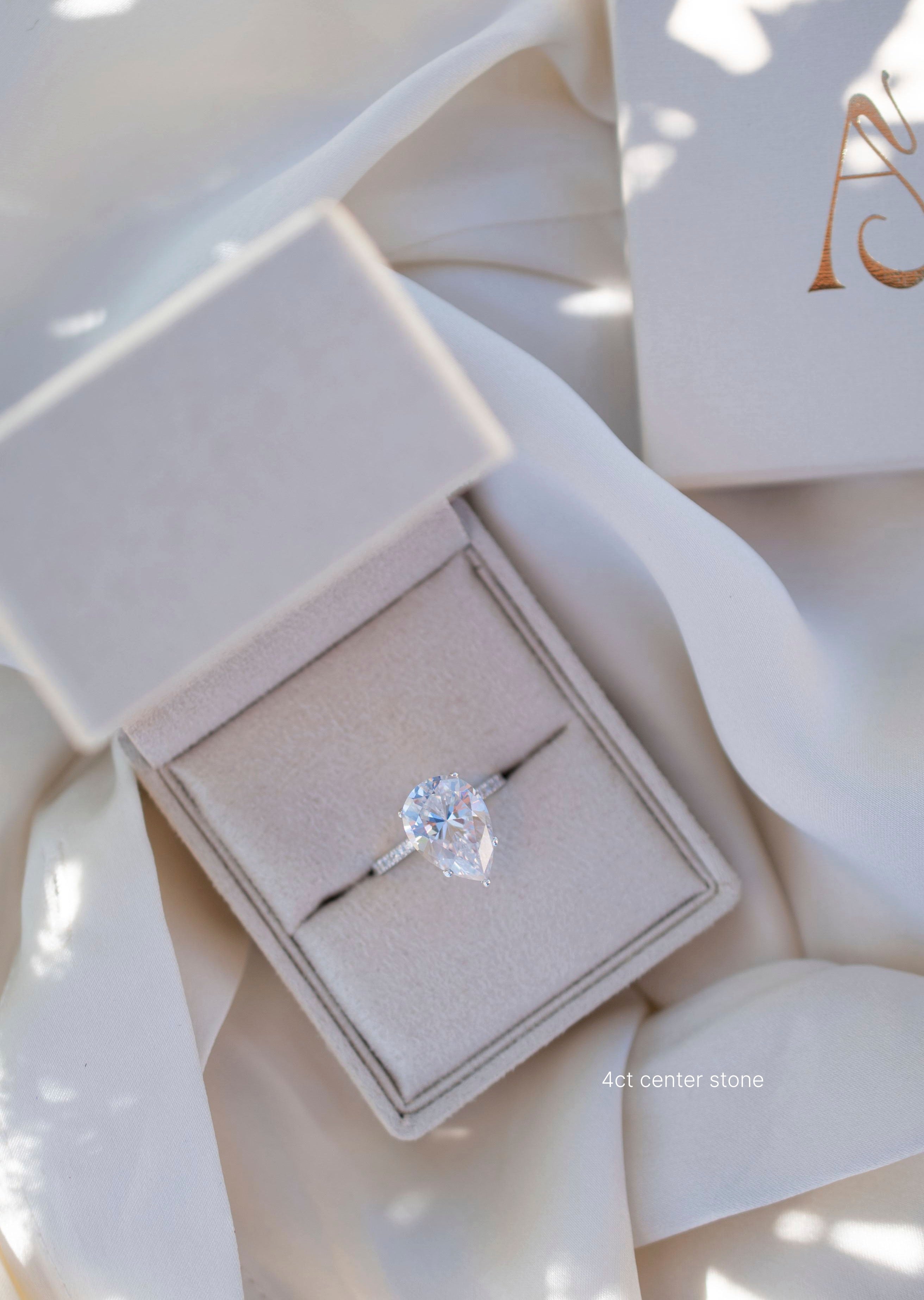 Pear solitaire engagament ring with pave band - platinum