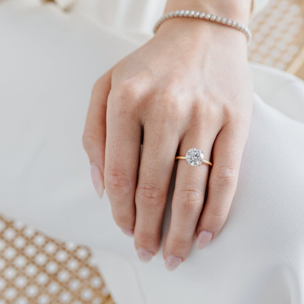 Round solitaire engagement ring 18-karat yellow gold with platinum p