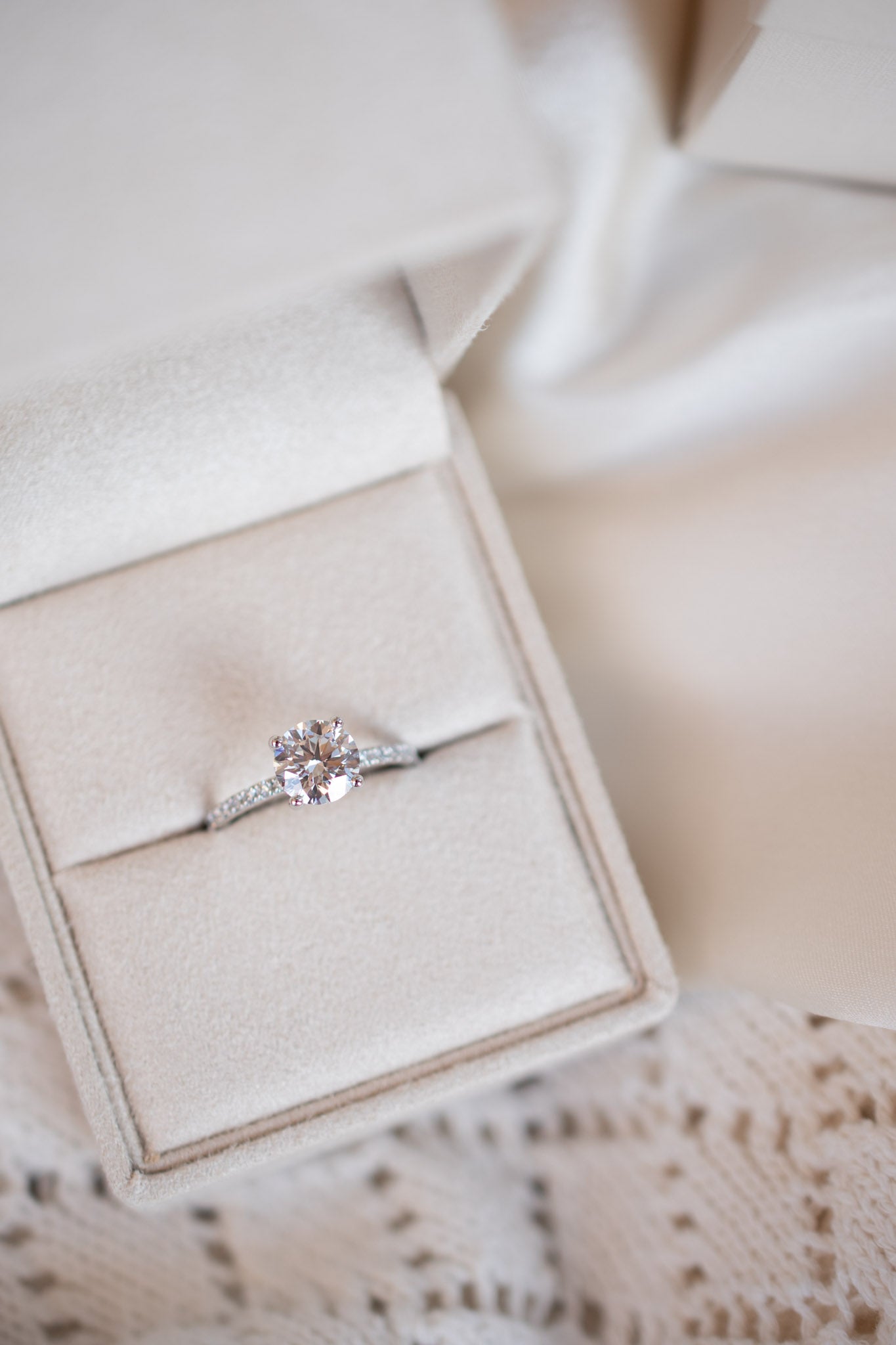 Round solitaire engagement ring with pave band - platinum