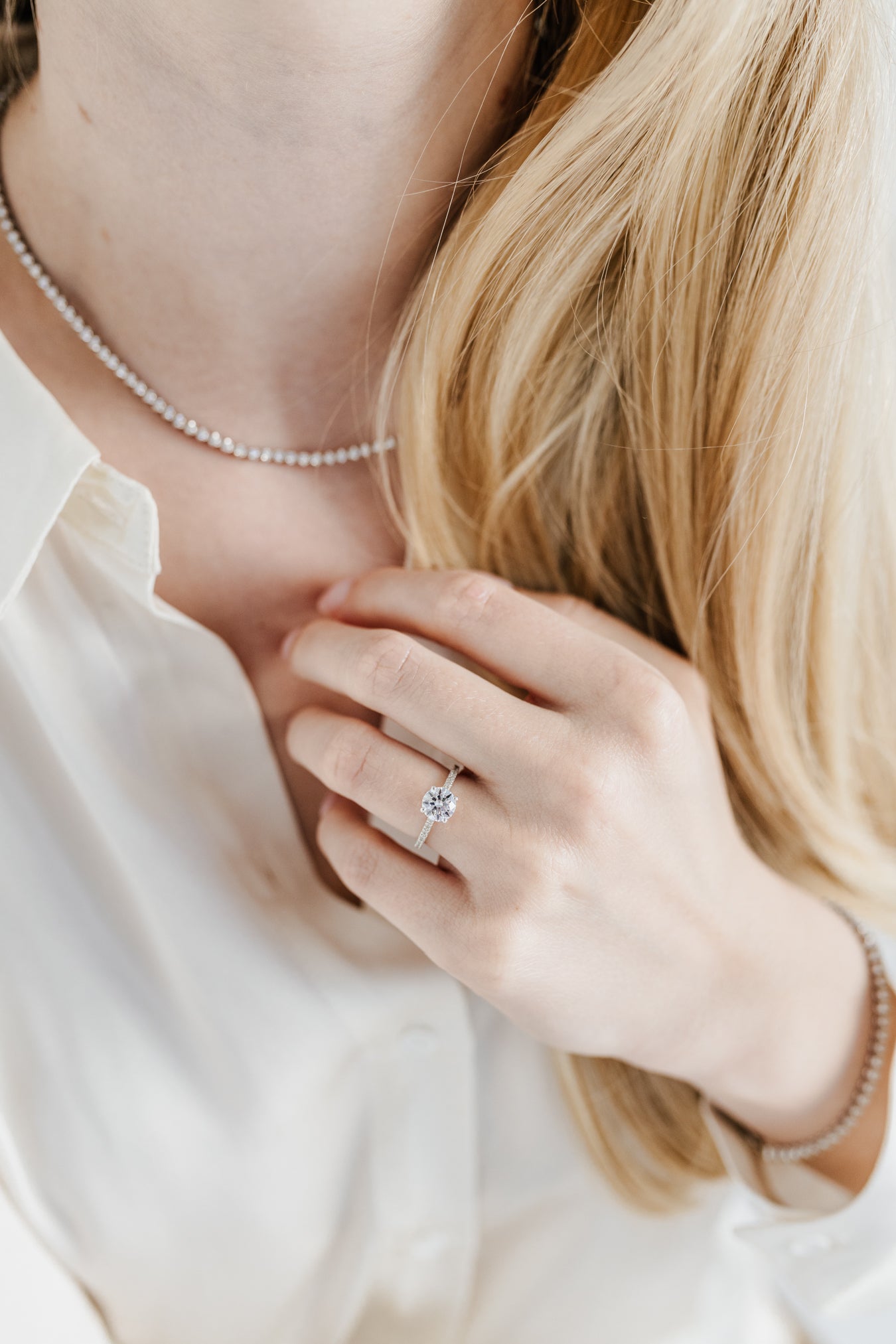 Round solitaire engagement ring with pave band - platinum
