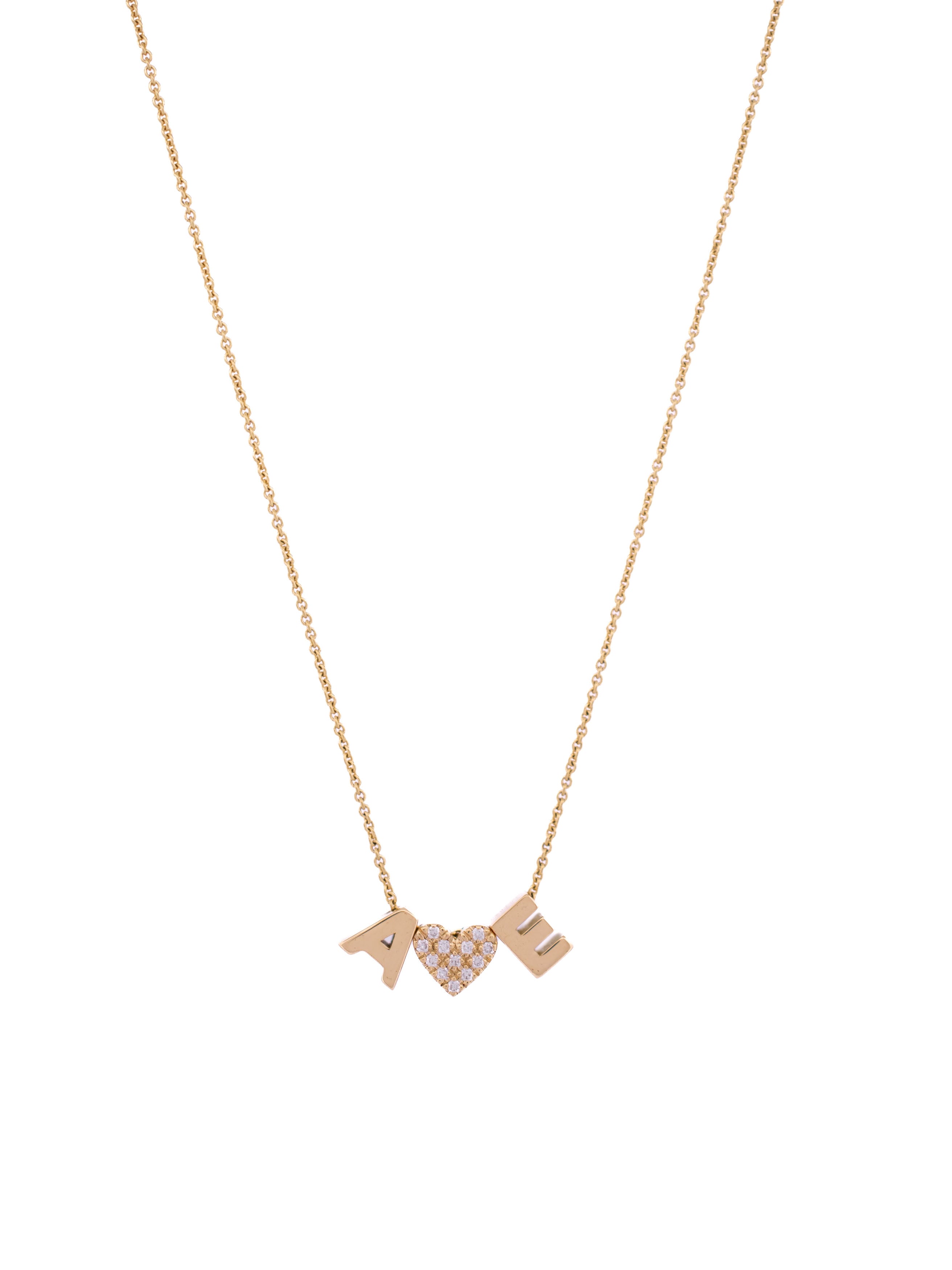 18-karat gold letter necklace with two gold letters and one diamond symbol